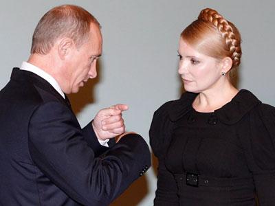 Владимир Путин объясняет Юлии Тимошенко, что Украина теперь будет сама выпутываться из сложного положения, в которое себя загнала. Фото EPA.